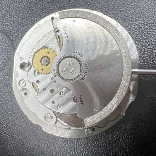 Miyota 9130 automatic mechanical movement with date display at 6 o'clock, precise watch accessory.