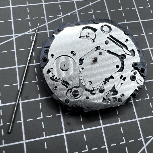 Japan Hattori Epson VX7J quartz watch movement with stem, precise timekeeping replacement part.