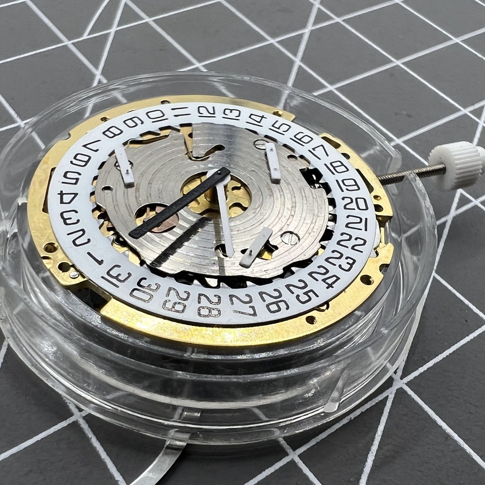 ISA 8171 Swiss quartz watch movement featuring date at 4, six hands on a white dial by ISA.