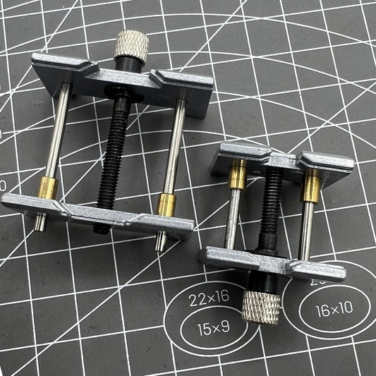 1. Metal watch movement holder clamp set for precise repair.