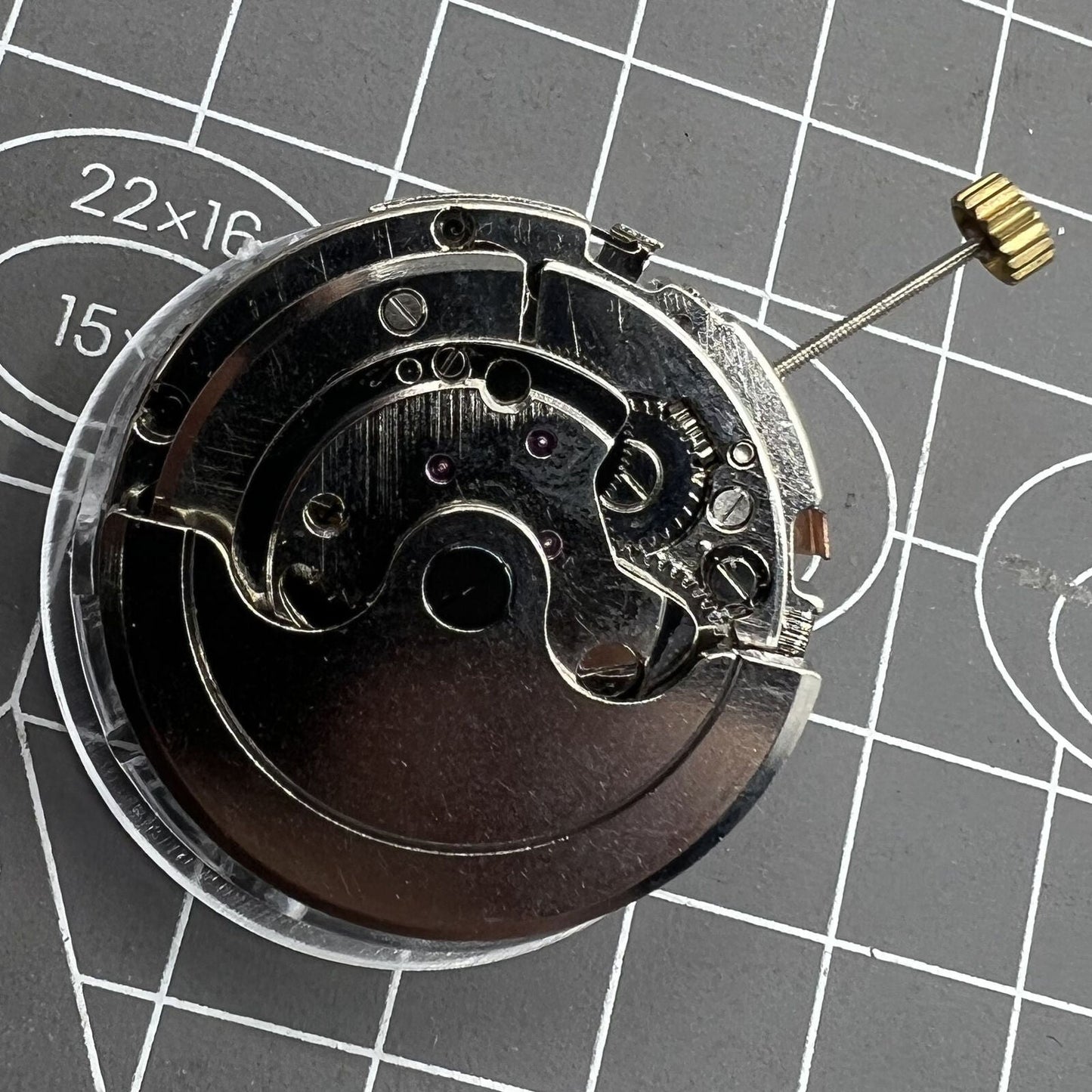 Automatic multifunctional watch showcasing mechanical movement with date at 12 o?clock and bare wheel at 6, branded design for precision.