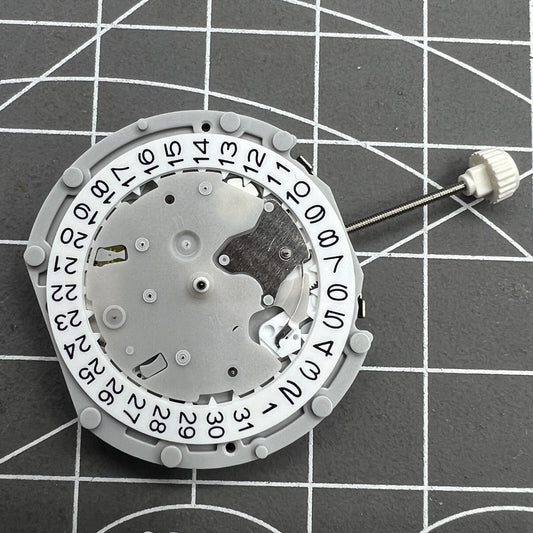 Sunon PE70 watch movement with 3 hands, date at 3, and small seconds at 3, 6, 9 positions.