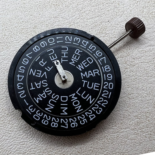 Swiss Ronda 517 quartz watch movement with 3 hands, double calendar, and black disk for precise timekeeping.