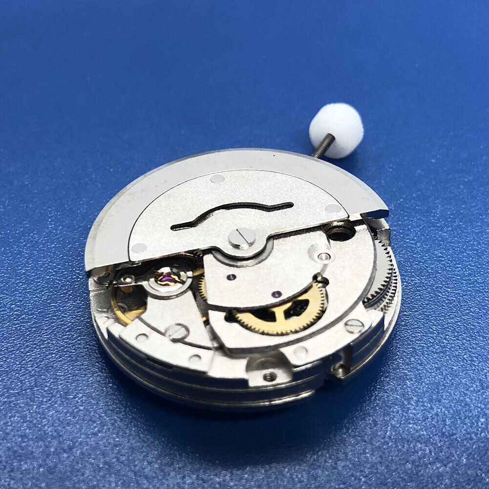 DG2813 silver watch accessory showcasing automatic mechanical movement, small second at 9 o?clock, and calendar window.