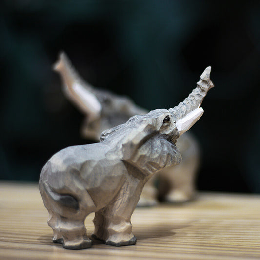 Handmade upturned nose elephant wooden figurine, decorative d�cor, perfect for home accents.