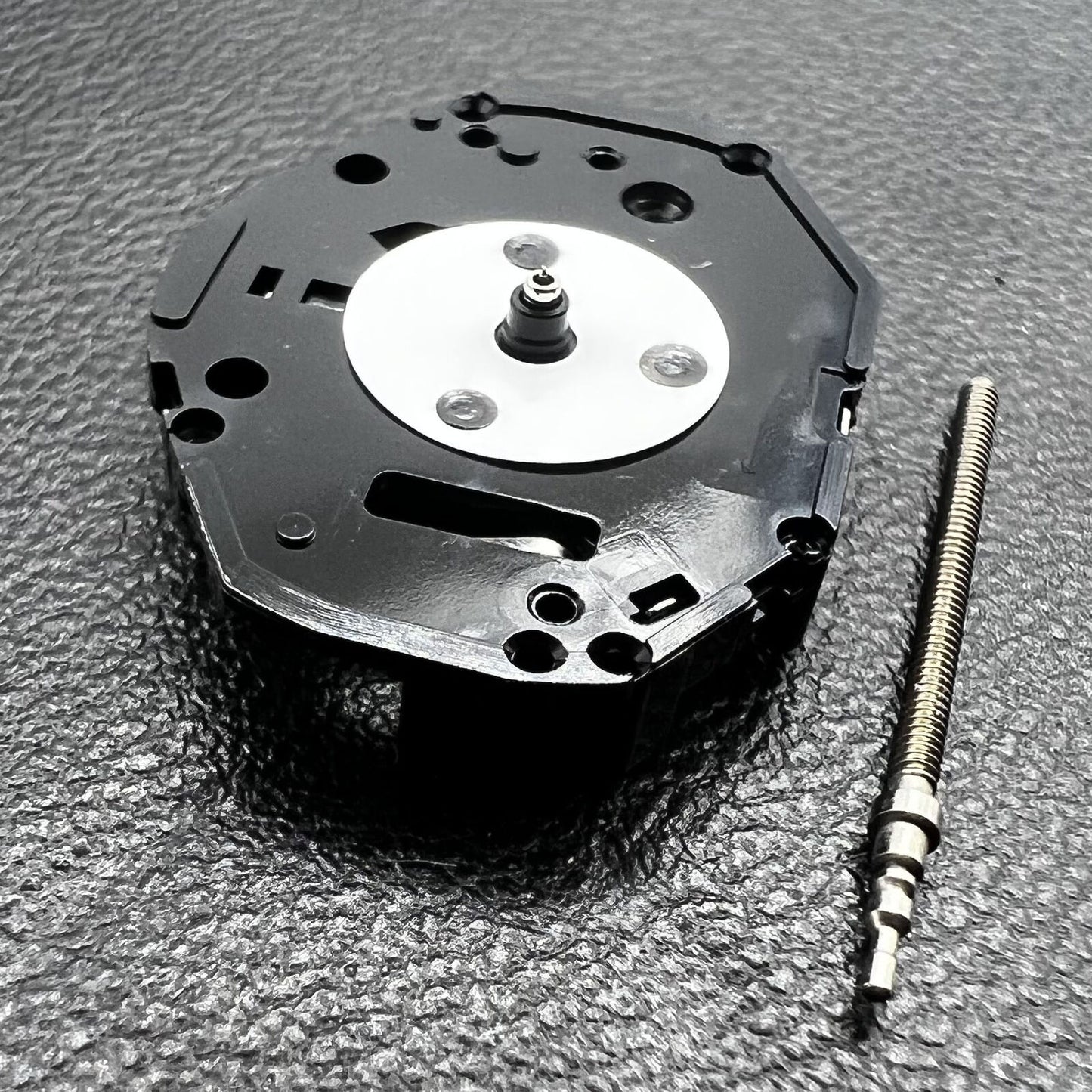 Hattori Epson PC21 quartz watch movement showing precise internal mechanism for timekeeping.