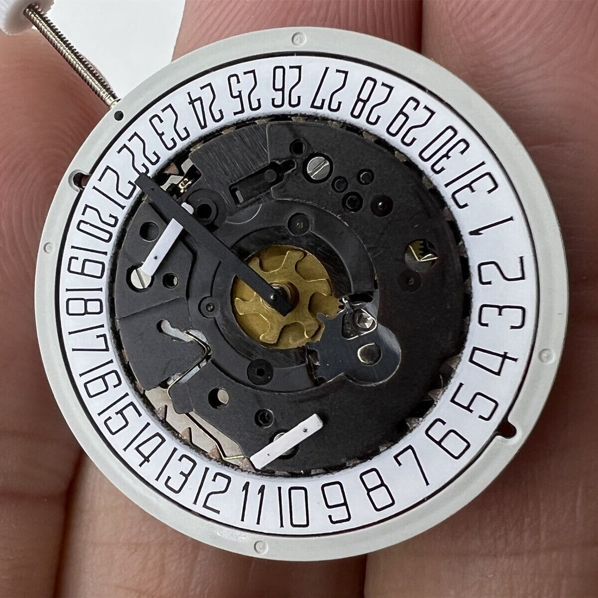 1. ISA 8172 Date At 6 quartz watch movement by ISA, precise timekeeping for repair.