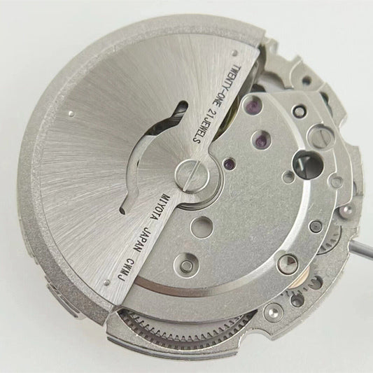 Miyota/Citizen 8215 watch movement with white dial and date at 6, automatic mechanical design.