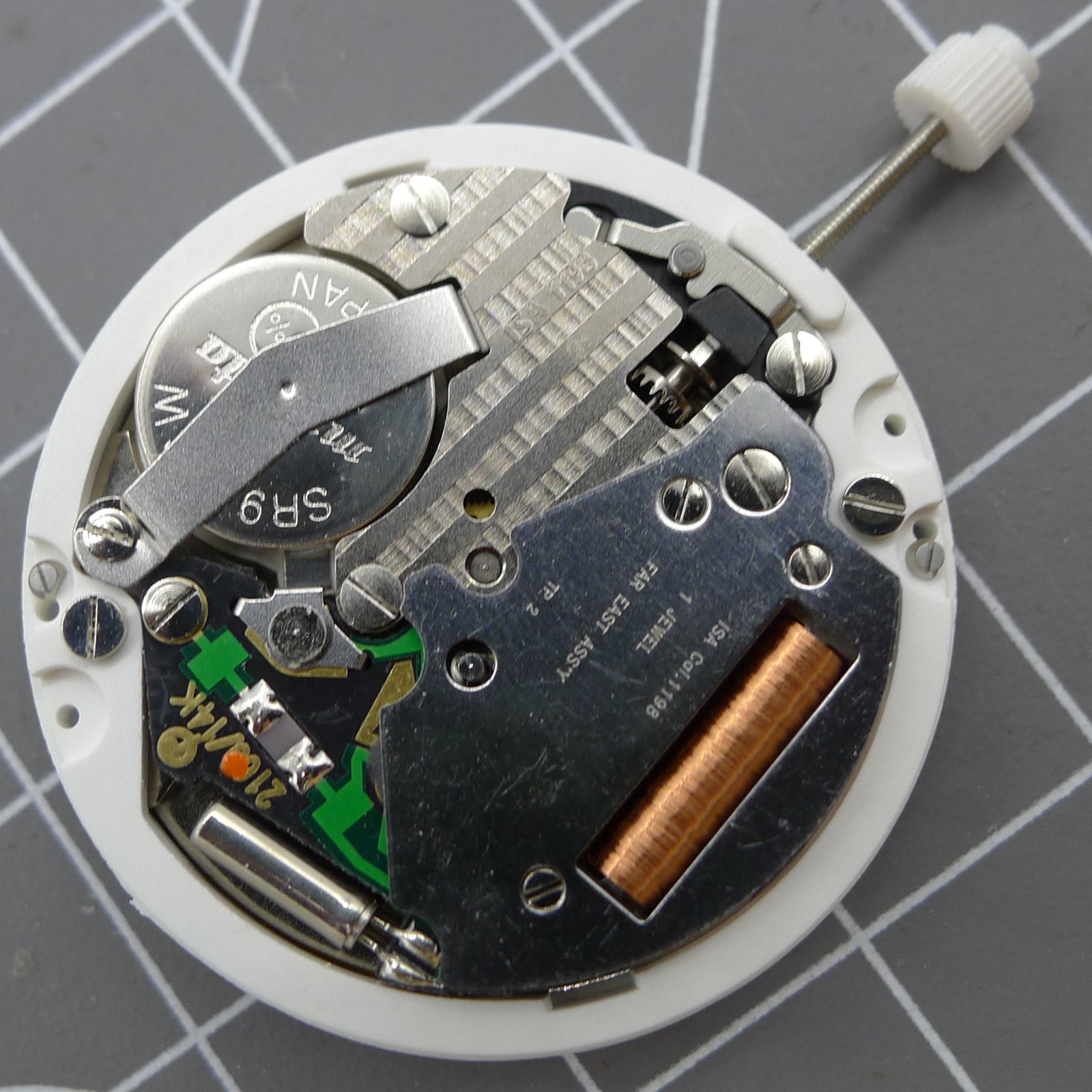 ISA 1198 quartz watch movement with day-date function and golden dial, replacement part.