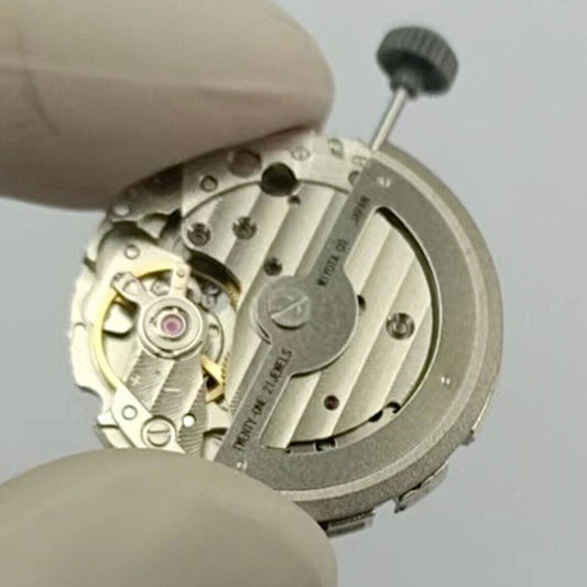Close-up of Japan Made Miyota 821A quartz watch movement for precise timekeeping replacements.