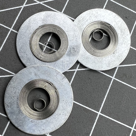 Mainspring for Epson YN55 YN56 watch movement, precision Japan-made part for accurate timekeeping.