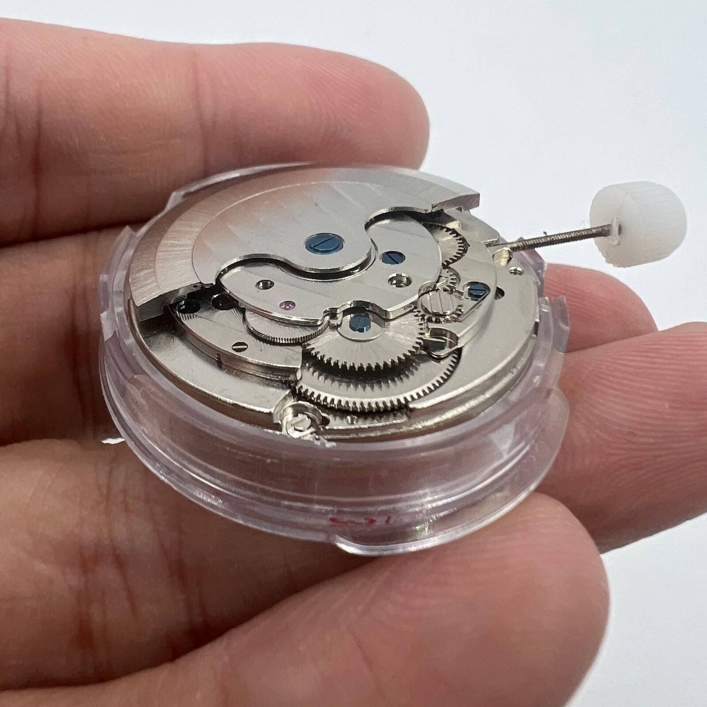 Shanghai LB20 automatic watch showcasing moon phase at 6 o'clock and big date at 12, highlighting Chinese craftsmanship.