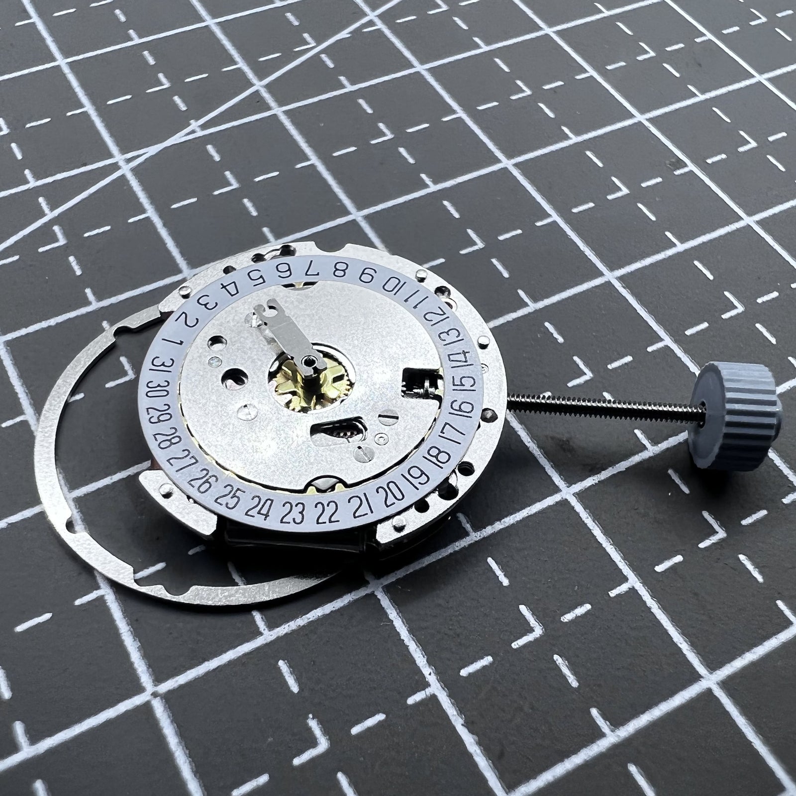 Swiss Ronda 775 quartz watch movement with date display at 6 o'clock, precise time by Ronda brand.