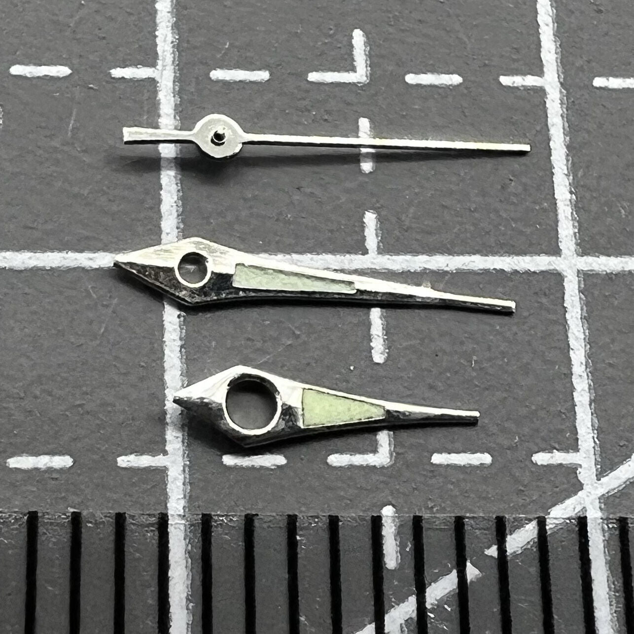 11mm Arrow shape watch hands with silver trim and green lume for Miyota 2035, 2115, 2105 movements.