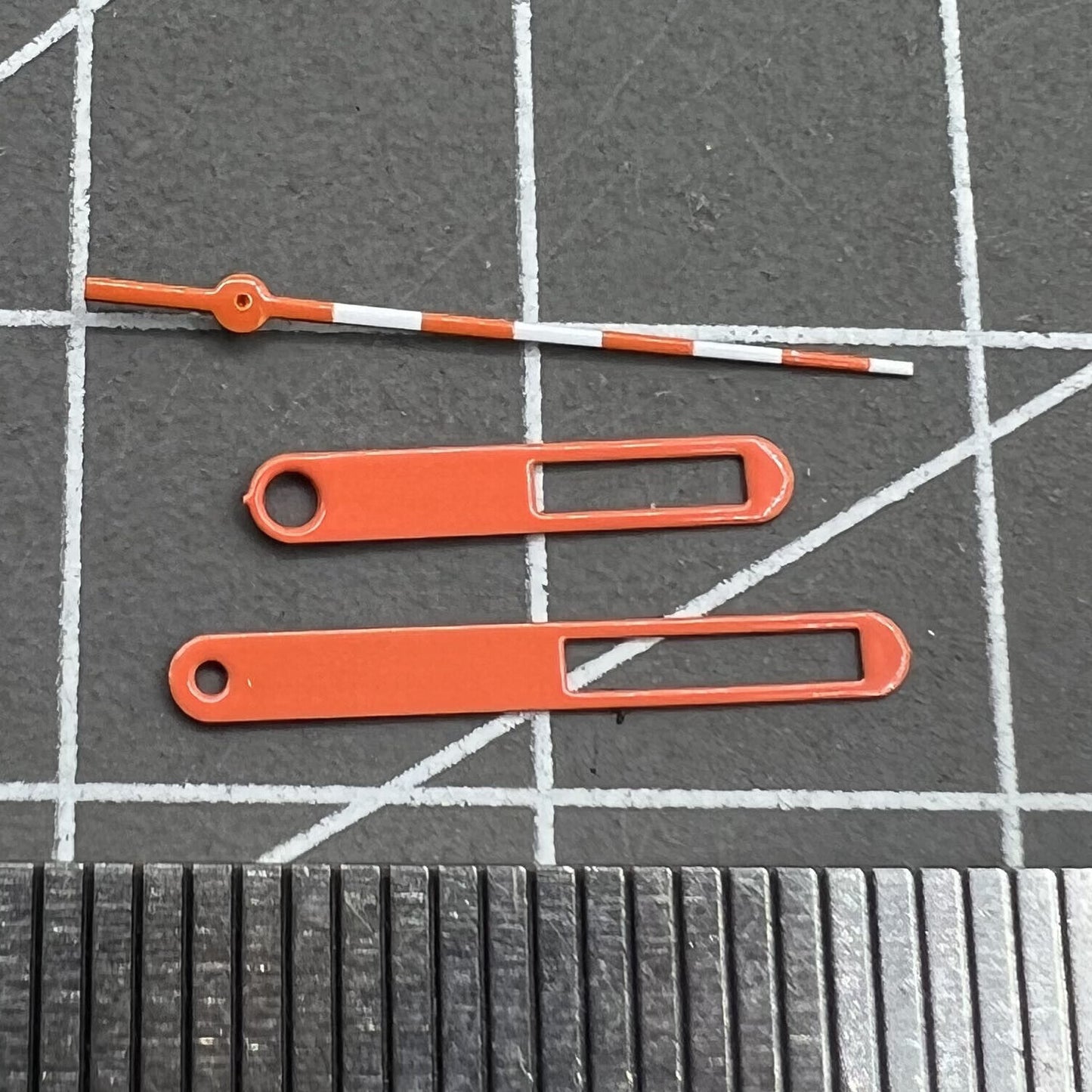 15mm Hollow orange and white trimmed watch hands for Ronda 515 movement, precise and stylish.