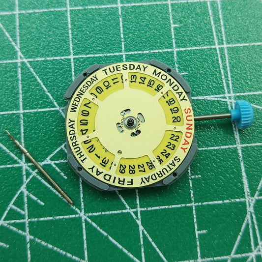 Miyota 6M50 quartz watch movement with golden dial and date at 3, reliable Japanese craftsmanship.