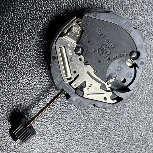 Swiss ETA 803.112 quartz watch movement with 3 hands and date window at 3 o'clock, precision timekeeping.