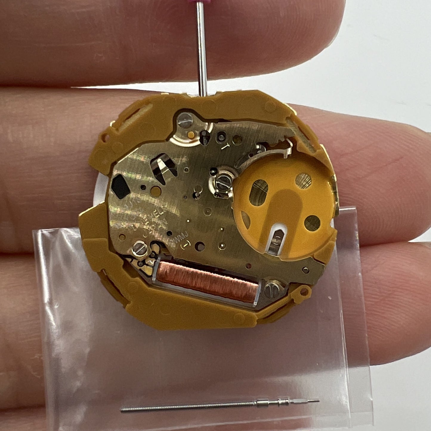 Miyota 9U13 quartz watch movement with date display at 6 o'clock, precise Japanese engineering.