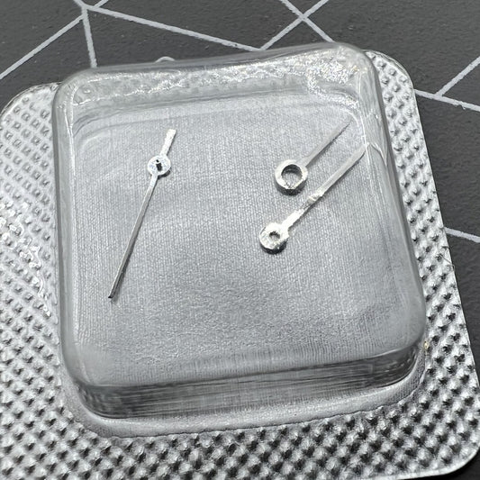Silver watch hands set for ETA 956.112 movement, including hour, minute, and second hands.