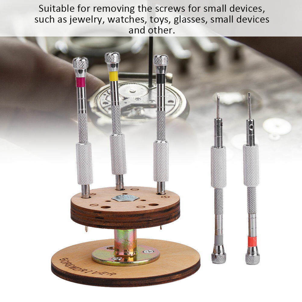 Set of 5 precision steel watch screwdrivers on rotary stand base for repair tasks.