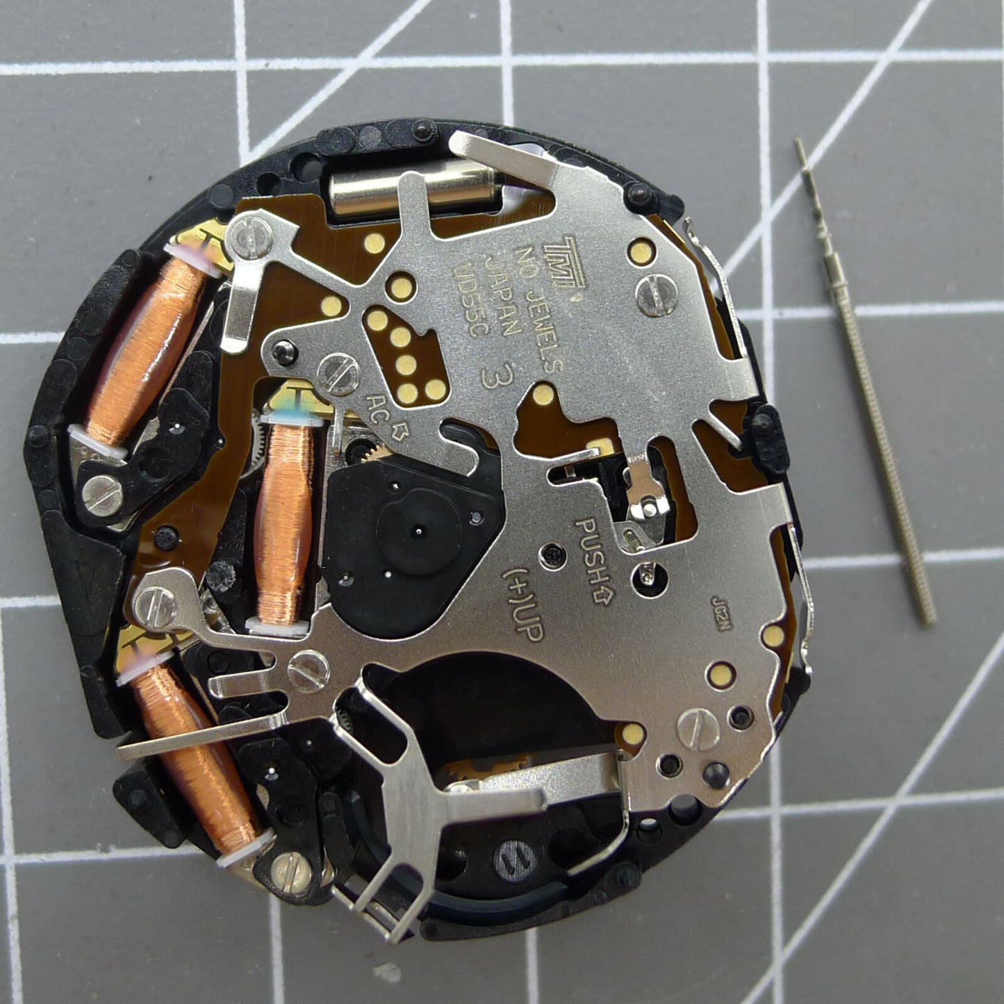 Hattori Epson TMI VD55 quartz watch movement, precision Japanese component for accurate timekeeping and repairs.