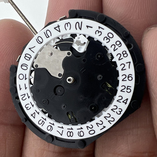 Sunon PE90 quartz watch movement with three hands and small seconds at 6, 9, and 12 o'clock positions.