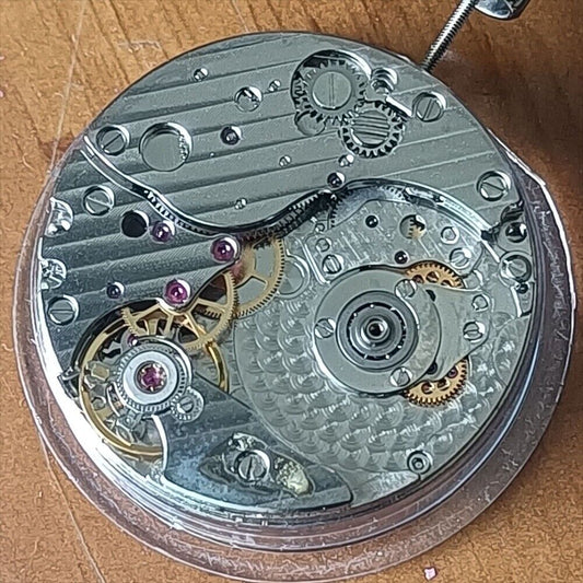 Hangzhou automatic mechanical watch with small second at 4 and moon phase display by China Made.