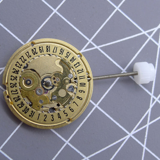 Golden dial ETA 256.111 V8 watch quartz movement by ETA, Swiss replacement for precise timekeeping.