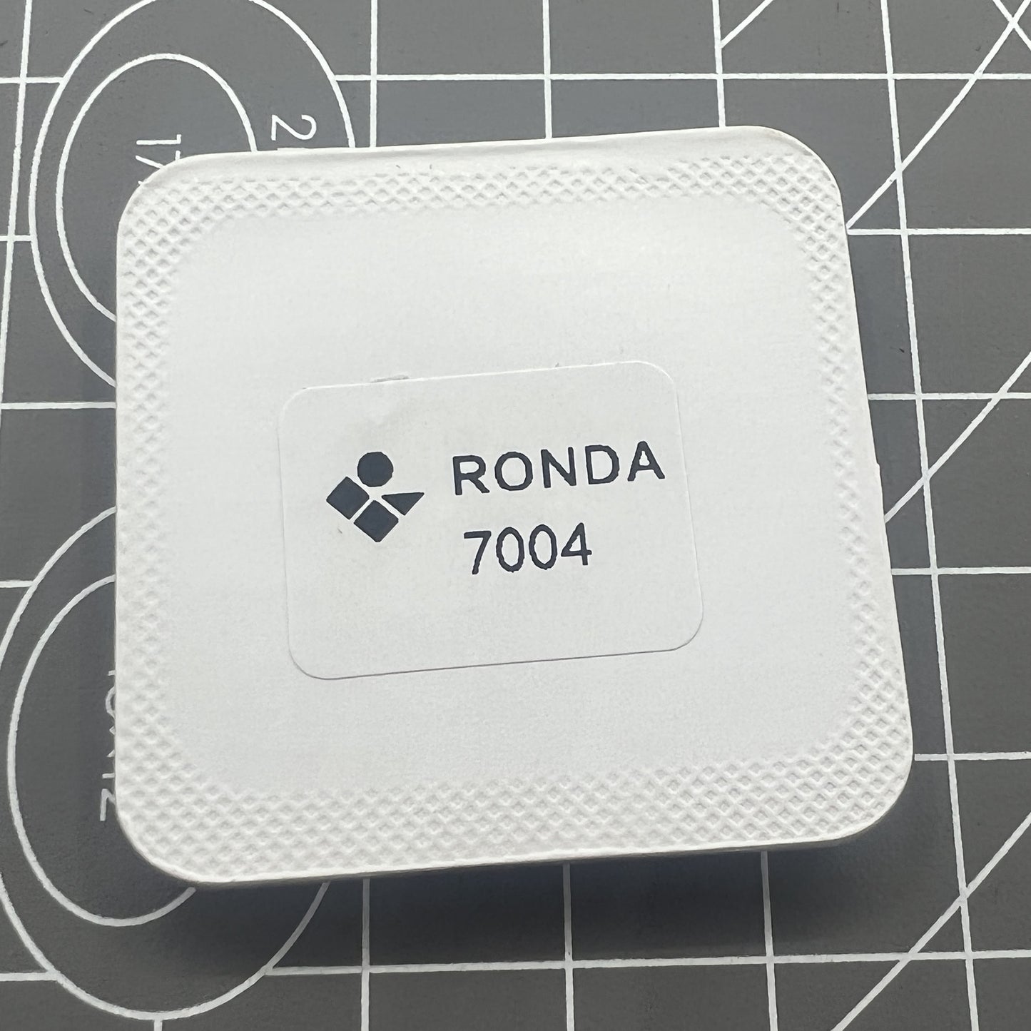 Circuit board for Ronda 7004.N watch movement, precision repair part for timepiece maintenance.