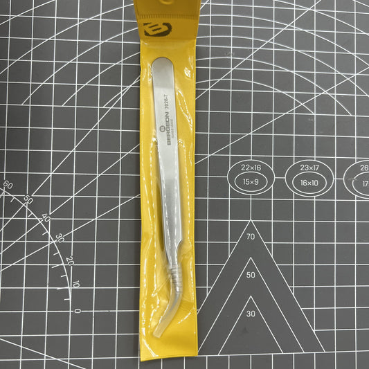 Swiss Bergeon 7026-7 antimagnetic tweezer with fine curved tips for precise watch repair tasks.