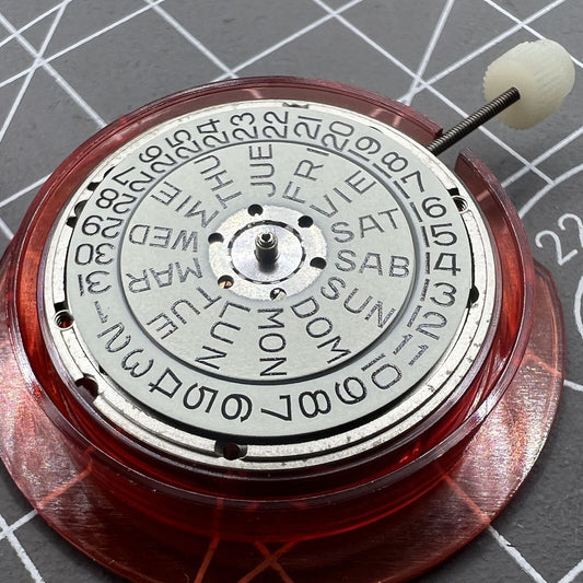1. ETA 955.424 quartz watch movement with 3 hands, day, and date functions for precise timekeeping.