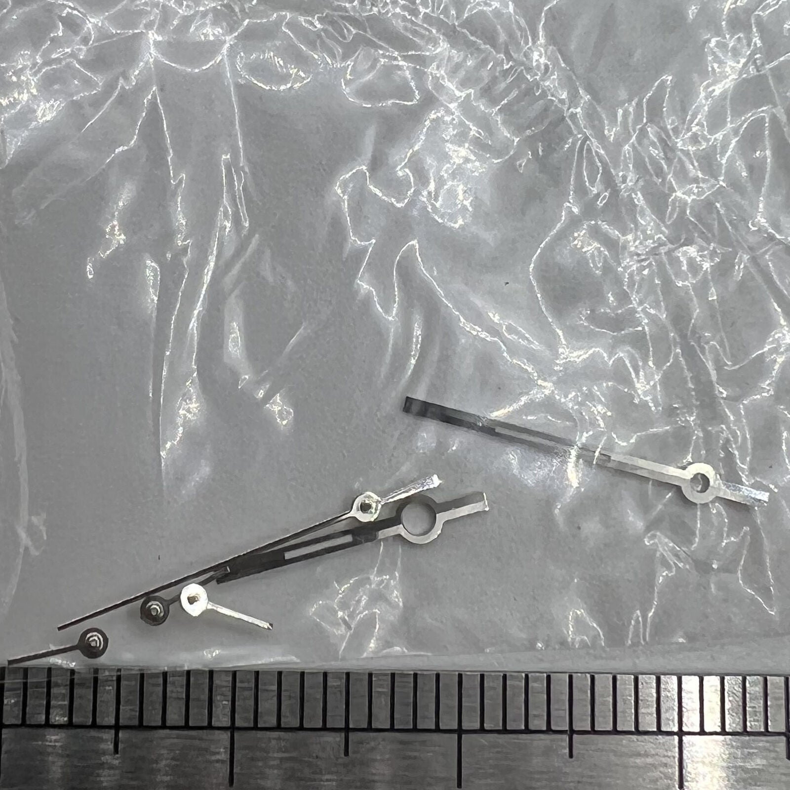 Silver trim watch hands for Ronda 5030.D quartz movement, precise fit with stylish design.