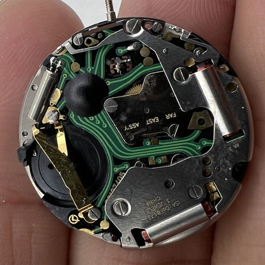 1. ISA 8172 Date At 6 quartz watch movement by ISA, precise timekeeping for repair.