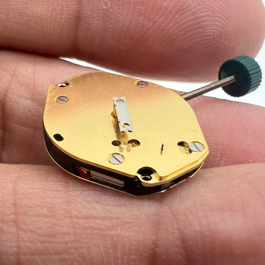 Ronda 1069 golden plated quartz watch movement, Swiss made for precise timekeeping.