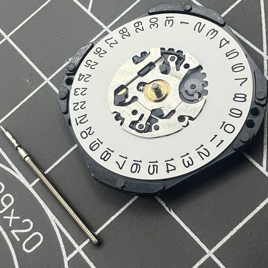 Hattori Epson TMI VX3K quartz watch movement with date at 3, precision Japan-made mechanism.