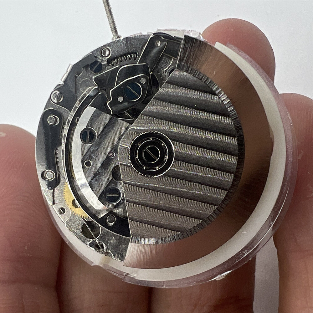 New China SHANGHAI 7750 automatic watch movement displaying day, date, and small seconds at 9 o'clock position.