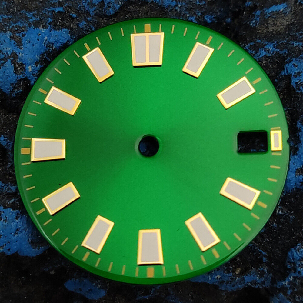 Green luminous watch dial with silver and golden nail trim, compatible with NH35 movement, for elegant timepieces.