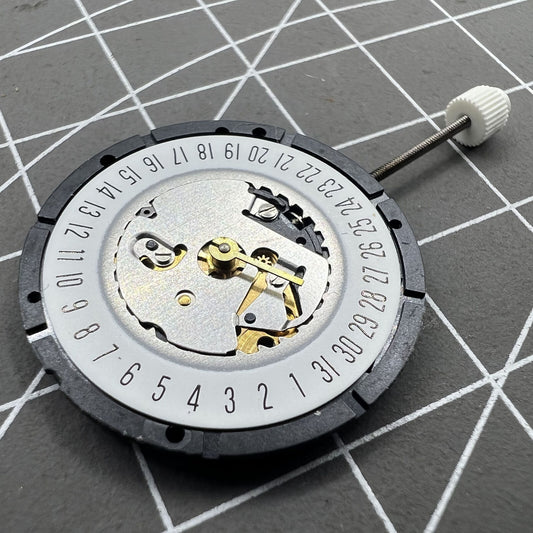ISA 330 quartz watch movement with date display at 6 o'clock, ideal for precise timekeeping.