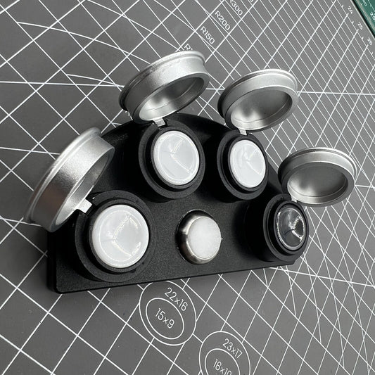 Die-cast alloy oil cup stand with 4 containers and black ceramic inserts for watch maintenance.
