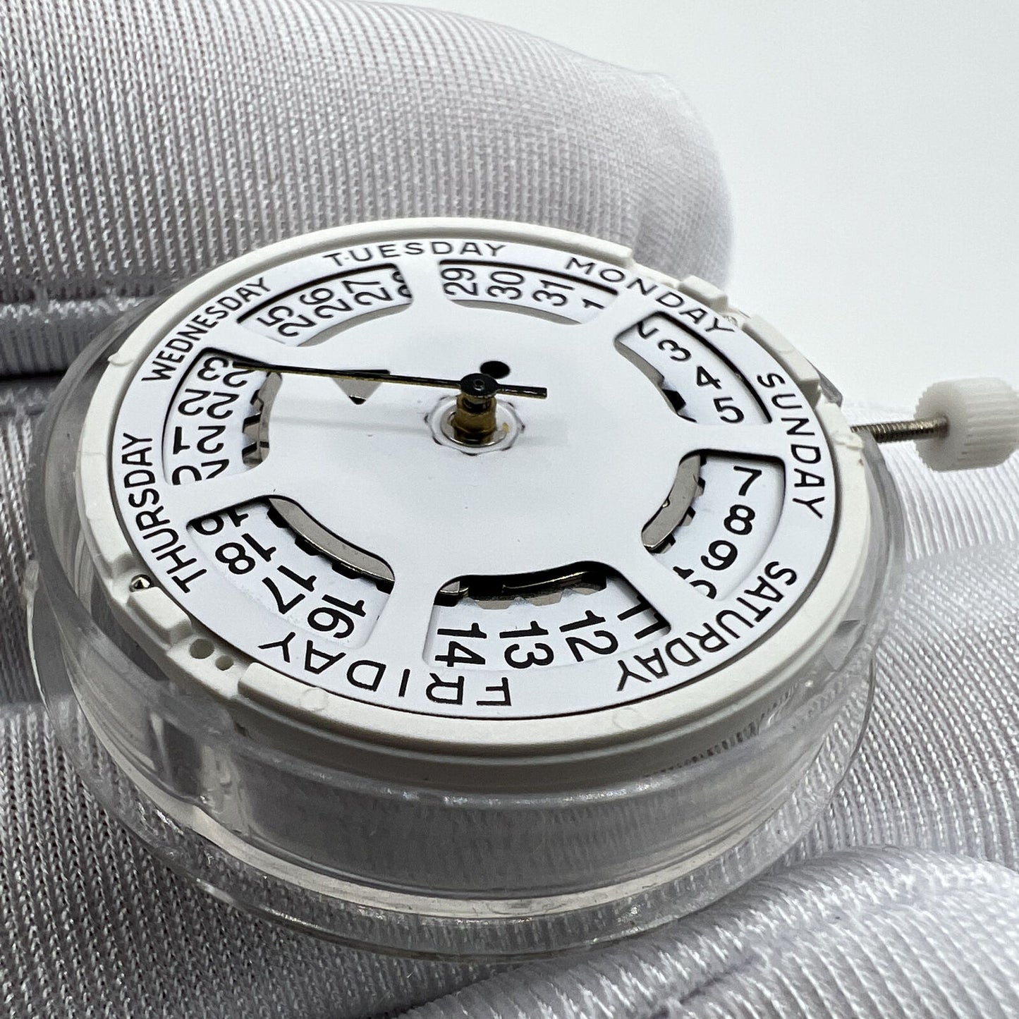 White dial ISA 1198 quartz day-date watch movement with date at 3, ideal for replacements.