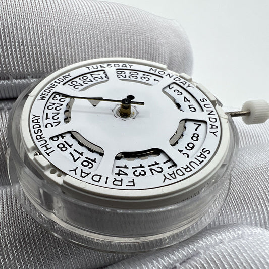 White dial ISA 1198 quartz day-date watch movement with date at 3, ideal for replacements.