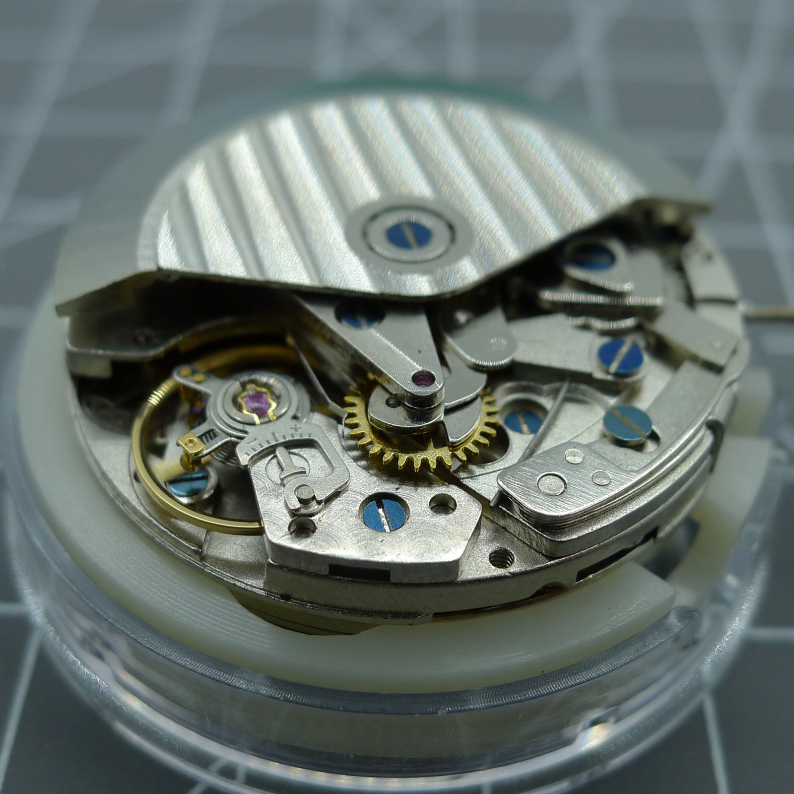 ETA 7750 chronograph watch movement displaying automatic day-date function at 3 o'clock, precision by ETA.