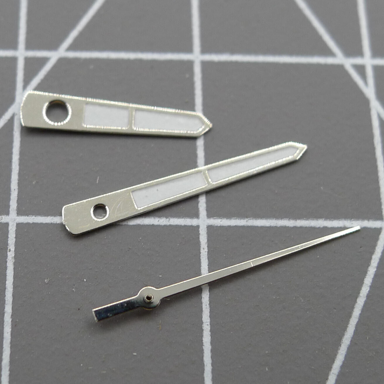 Arrow-shaped silver trim 12mm watch hands for Miyota 2315 and related movements, precise timepiece parts.