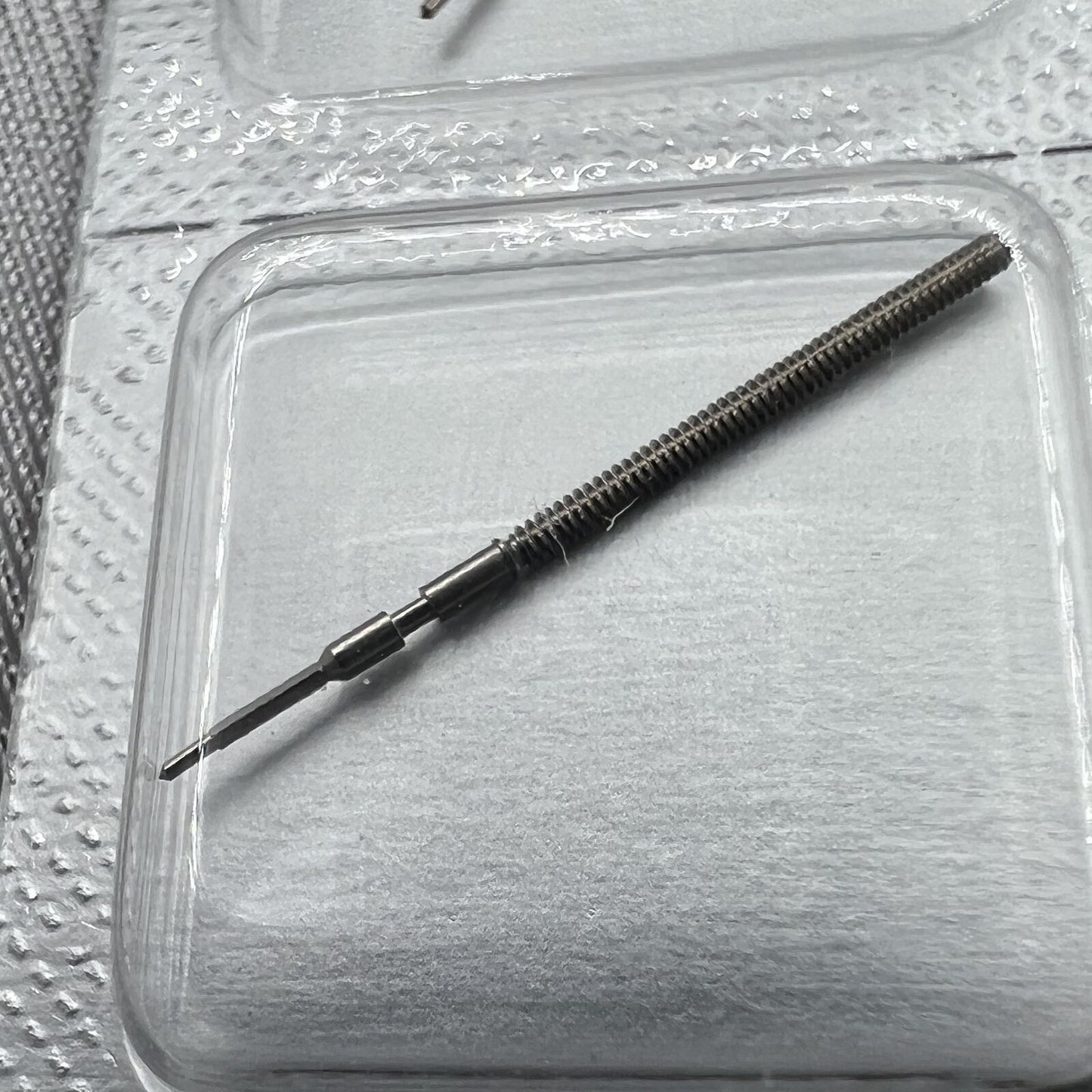 Swiss Made Ronda 1015 winding stem for precise watch repair and replacement accessories.