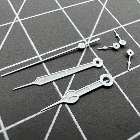 Silver-trimmed green luminous watch hands set for Miyota 0S20 quartz movement, enhancing dial visibility.