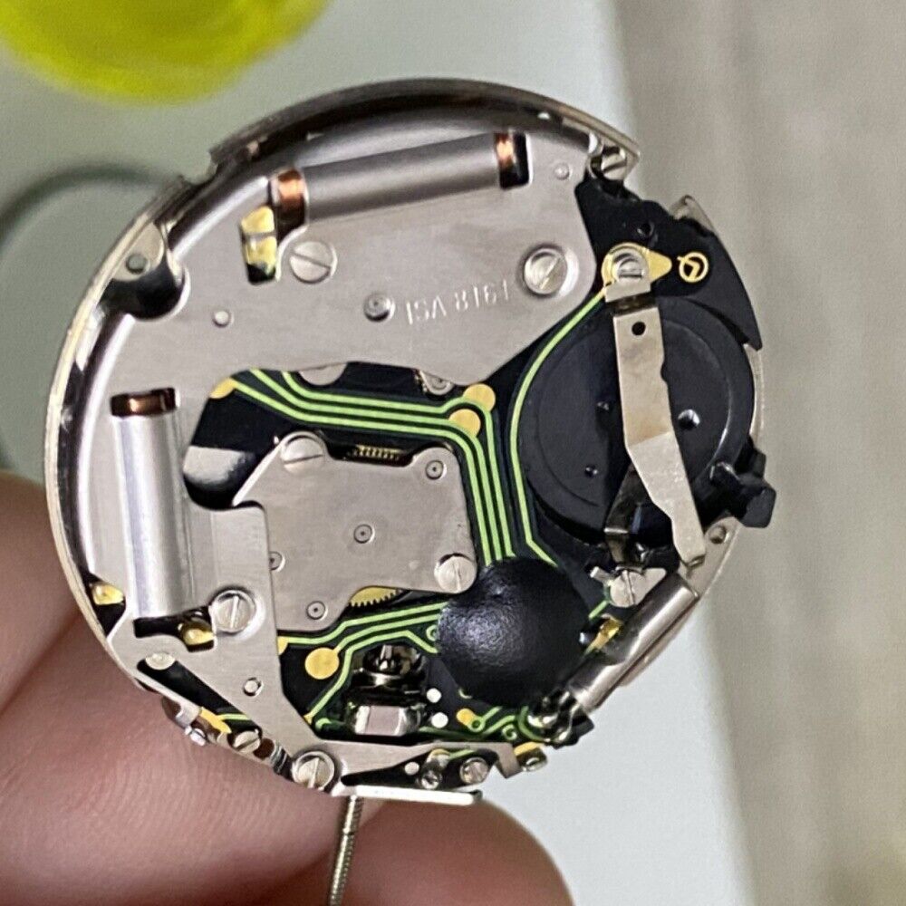 Silver ISA8171 watch accessory featuring ISA 8161 quartz movement, white dial, date at 6, and six-hand display.