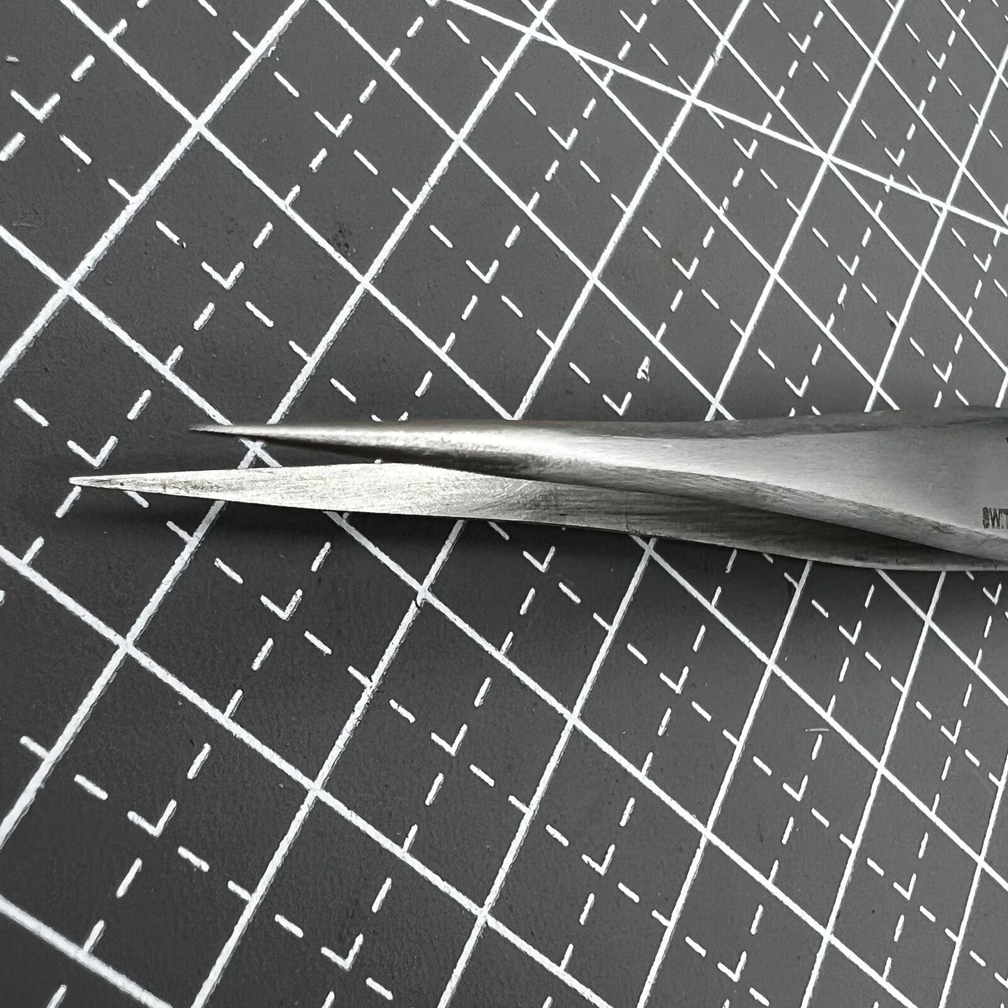 ST10 antimagnetic stainless steel tweezer for precise watch repair and accessory handling.