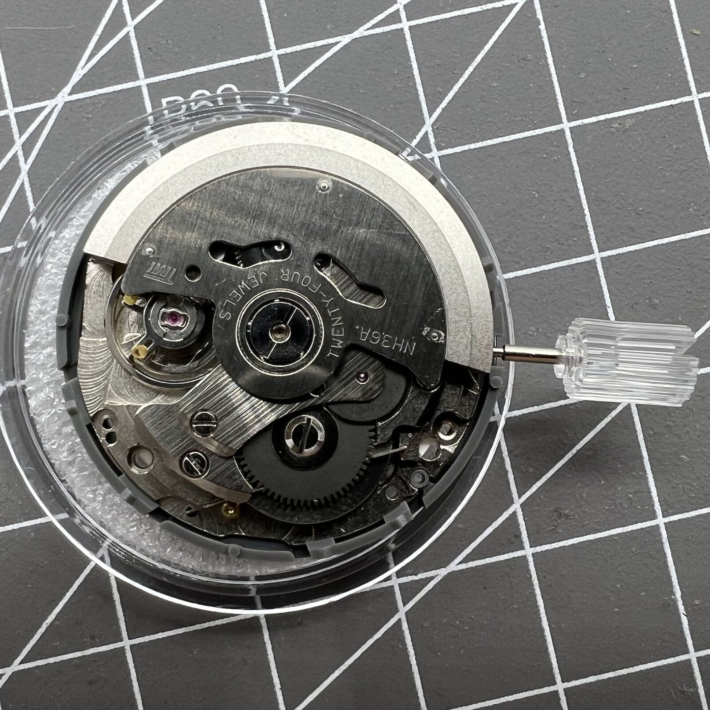 Miyota NH36A watch movement featuring white dial, blue luminescent markers, and 3/3.8 crown for accuracy.