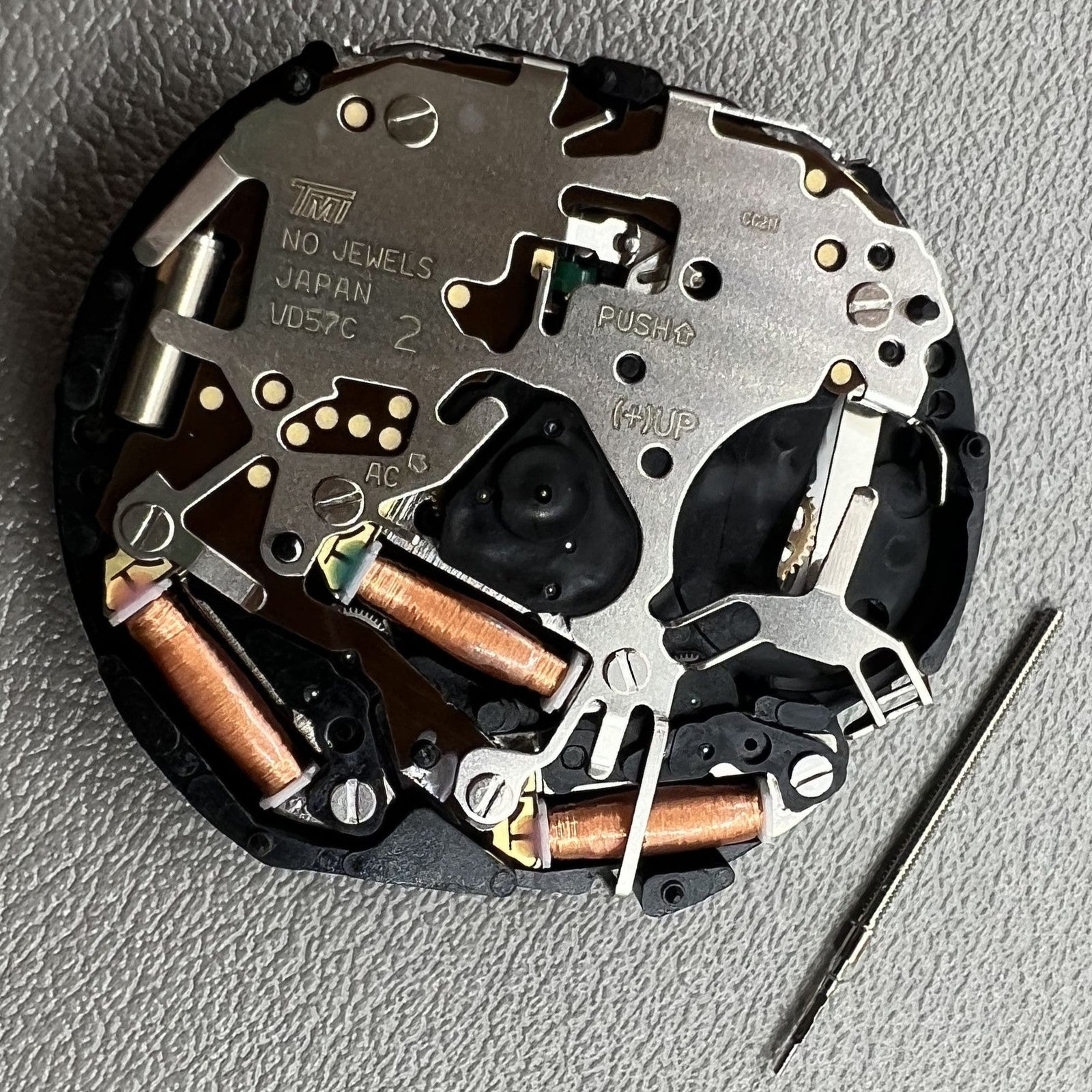 Japan Hattori Epson VD57C quartz watch movement for precise timekeeping in accessories.