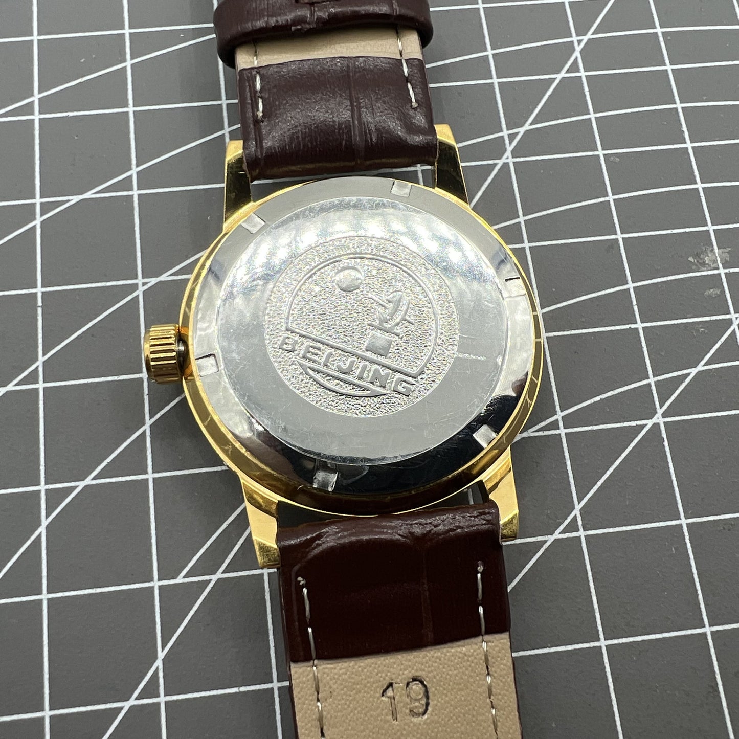 Beijing Double Rhomb manual watch, golden case, silver nail markers, classic style for elegant occasions